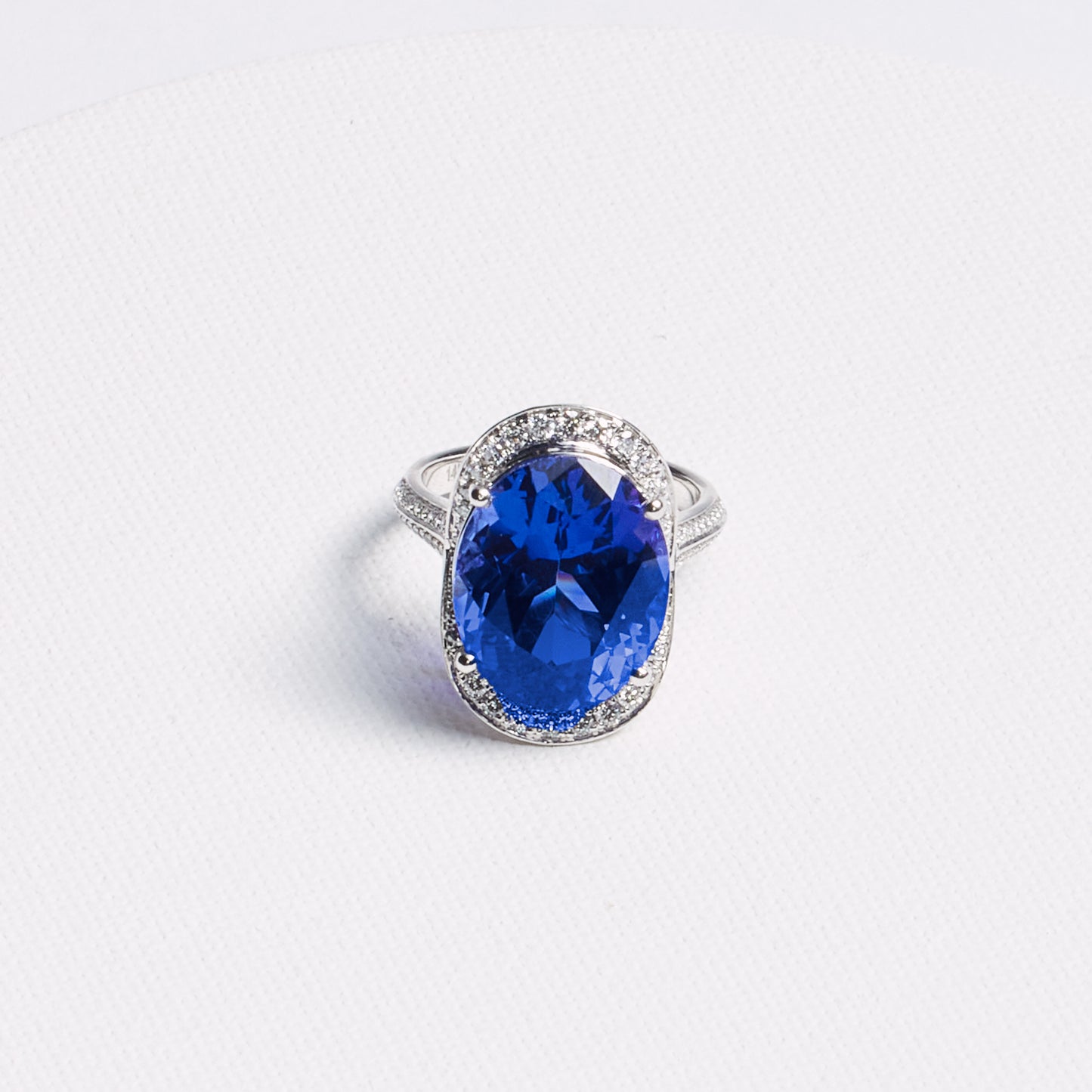 Oval Tanzanite Halo Ring with Pavé Band · 13.42ct · 14K White Gold