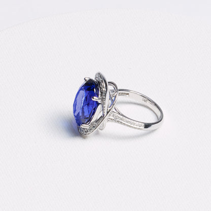 Oval Tanzanite Halo Ring with Pavé Band · 13.42ct · 14K White Gold