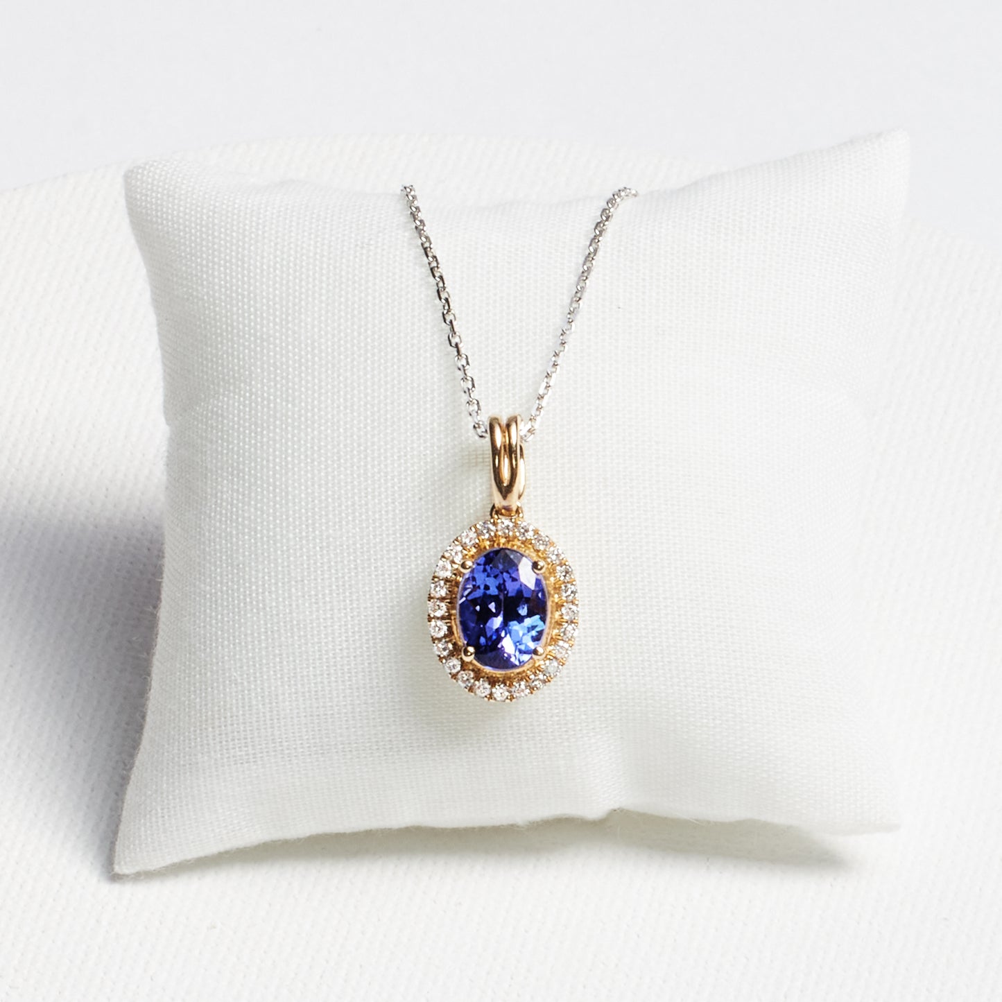 Oval Tanzanite Pendant with Diamond Frame · 1.28ct · 14K Yellow Gold