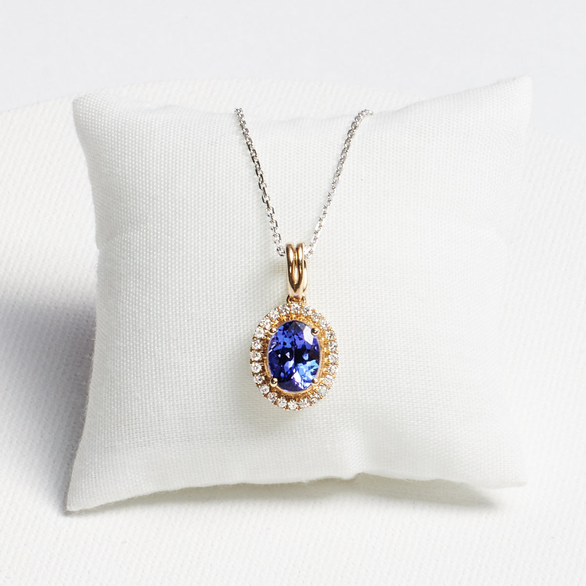 Oval Tanzanite Pendant with Diamond Frame · 1.28ct · 14K Yellow Gold