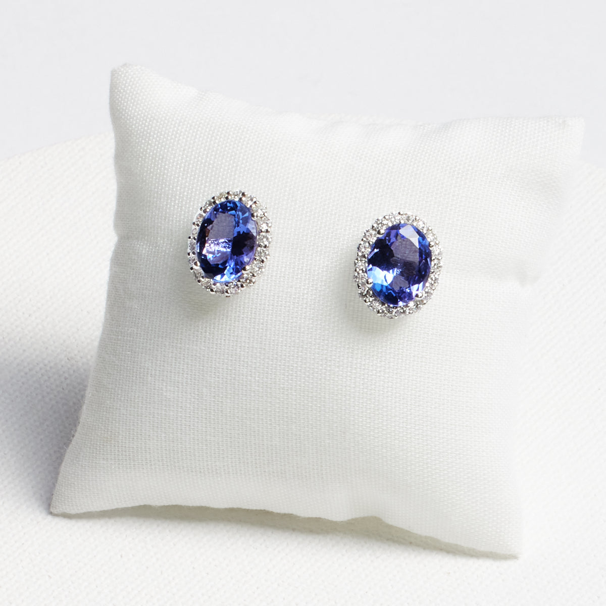 Oval Tanzanite Stud Earrings with Diamond Halo · 3.85ct · 18K White Gold