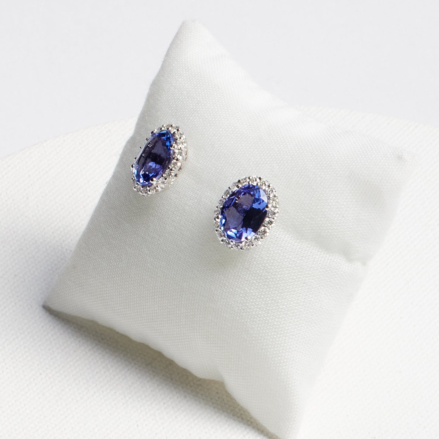 Oval Tanzanite Stud Earrings with Diamond Halo · 3.85ct · 18K White Gold